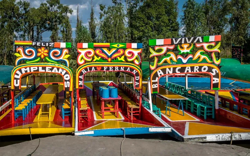 Colorful trajinera boats on the Xochimilco canals near the Frida Kahlo museums in Mexico City, Coyoacan